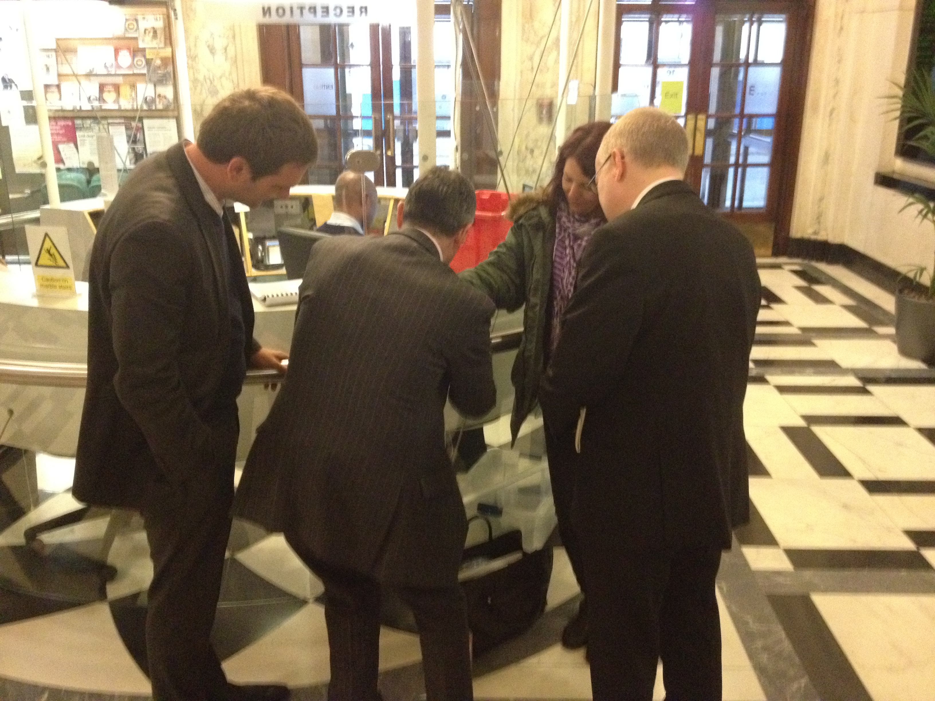 Woman handcuffs herself to Town Hall reception desk in protest over offensive graffiti photo1