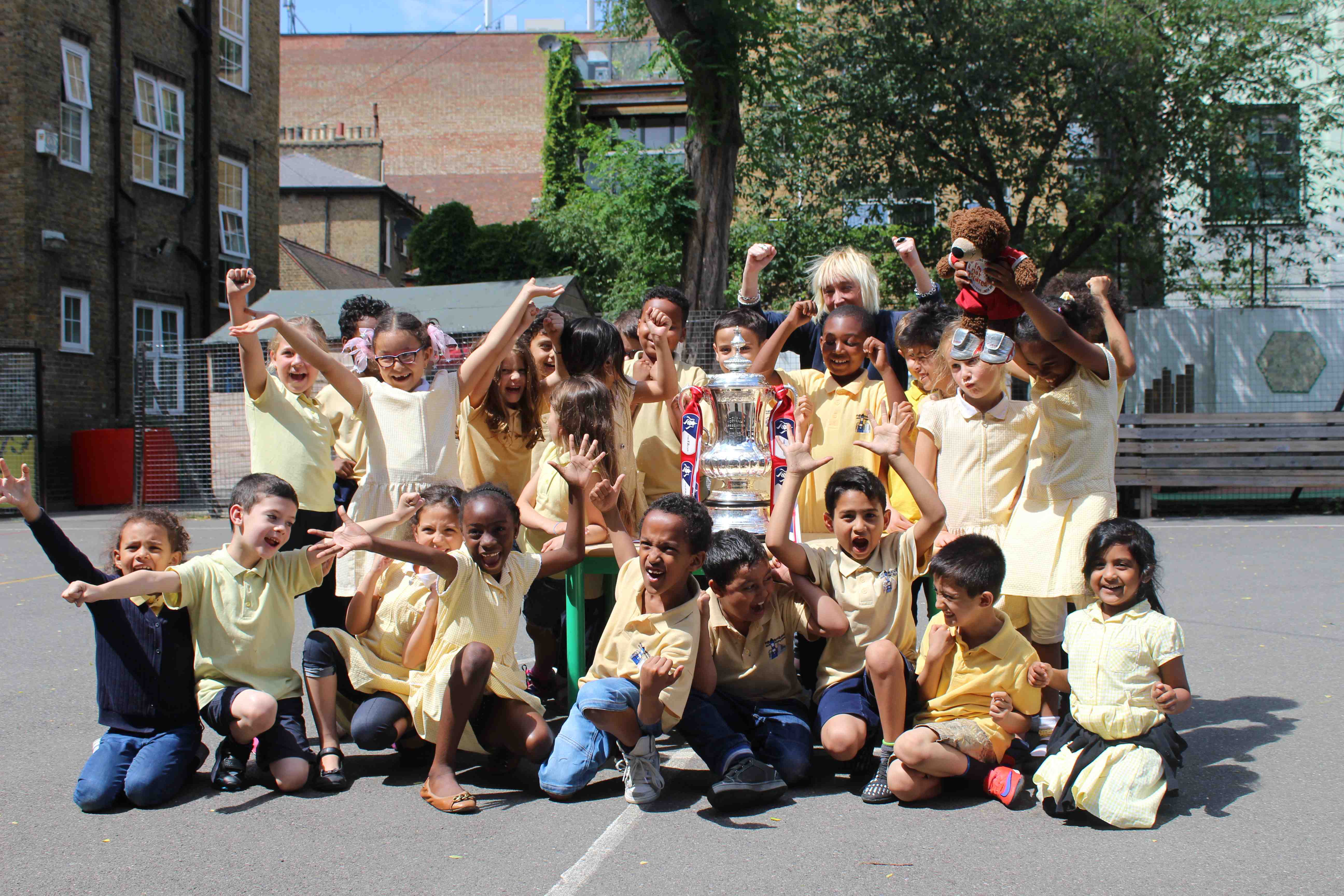 Arsenal parade FA Cup trophy at Camden Town primary school Camden New
