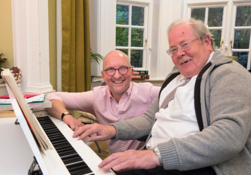 Music therapist Gary Ansdell at the piano with Rathmore House resident John Beaver