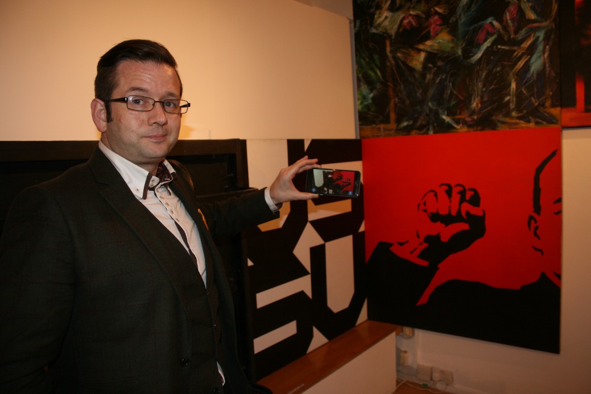 Nick Bingham of GAMAR shows how visitors can interact with Lenin... through their phones