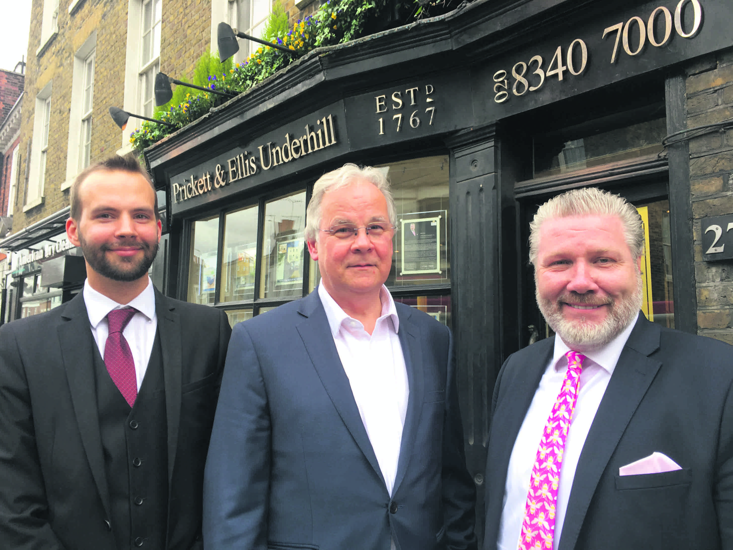 Company directors Philip Ellis,  Nigel Ellis and Chris Underhill outside the Highgate high street office of estate agents Prickett and Ellis