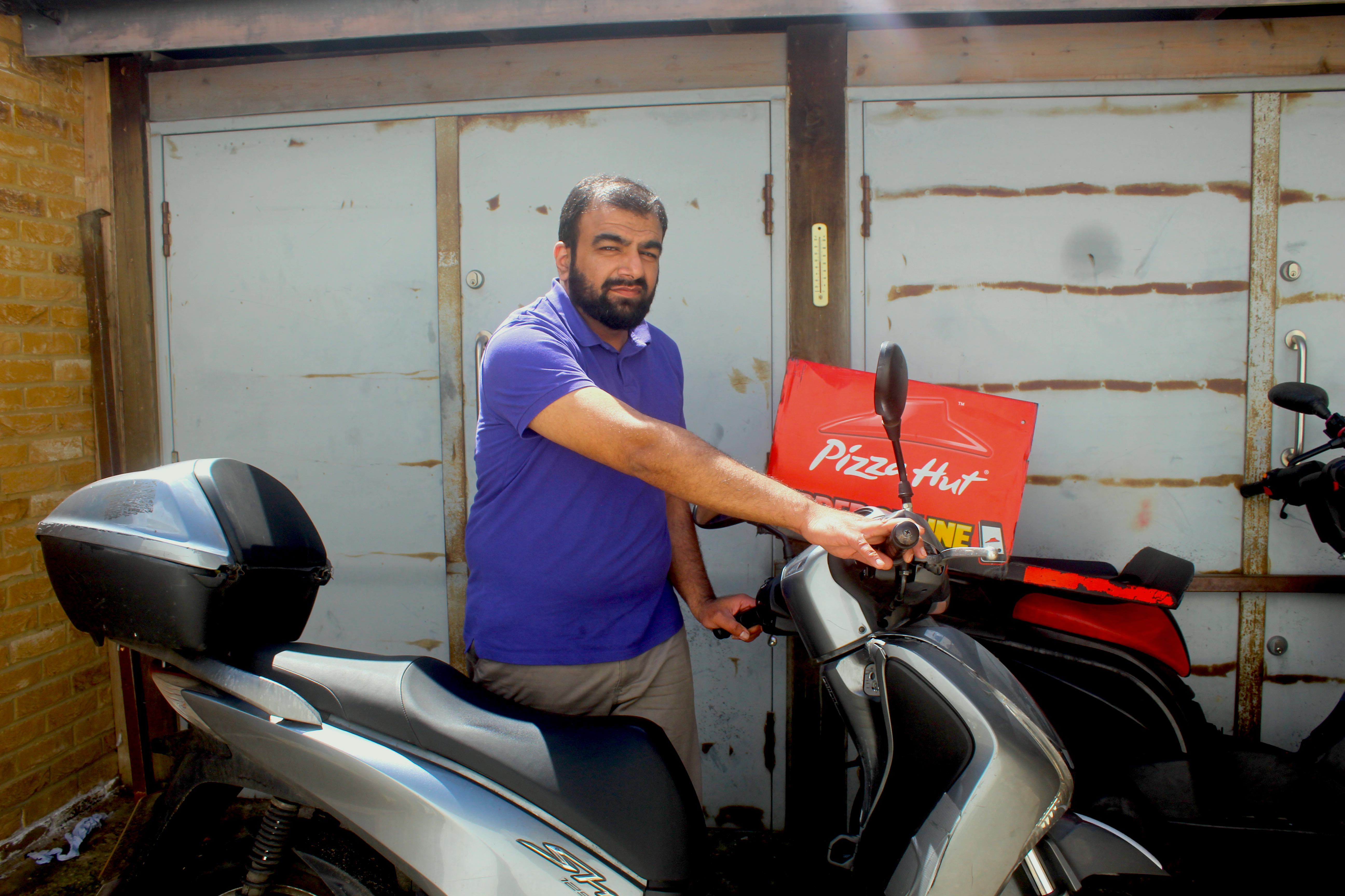 Pizza delivery drivers targeted by moped thieves Mudassar Saleem, manager of Pizza Hut delivery in Tufnell Park, with one of the business’s motorbikes