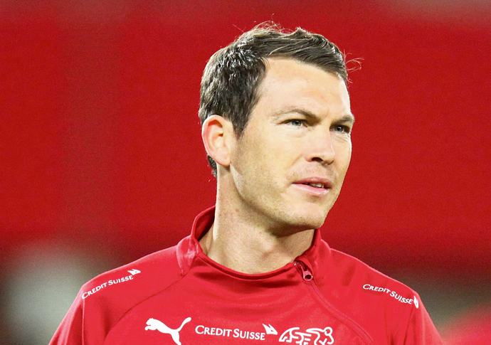 Arsenal survive scare to set up cup clash with arch rivals Spurs Stephan Lichtsteiner credit Steindy cutout