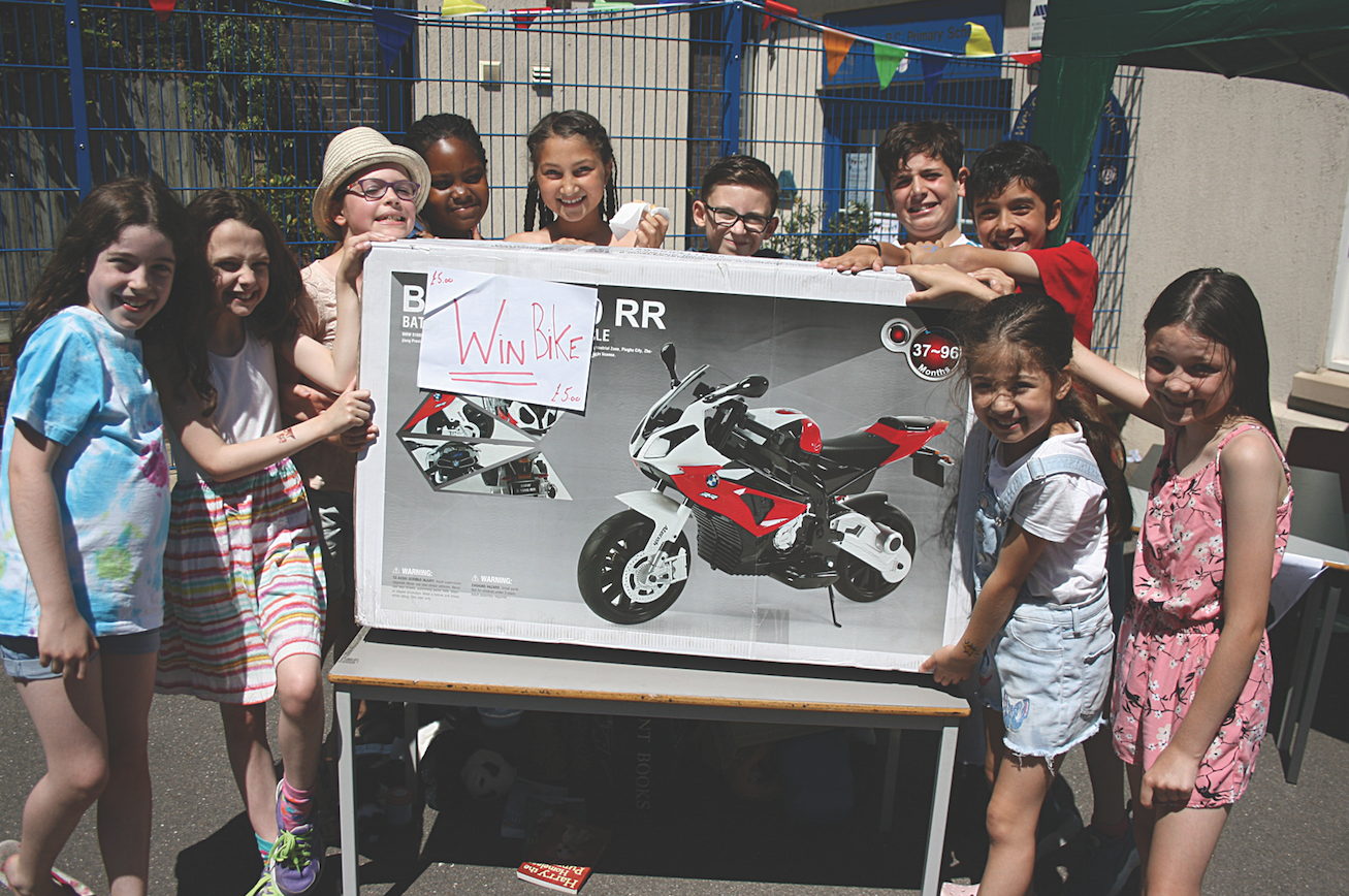 Headteacher retires after 32 years at Rosary School Pupils with the big raffle prize at Saturday’s summer fair