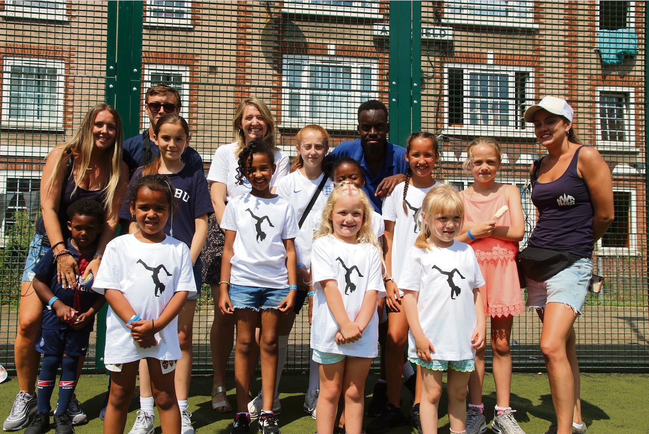 Awe-inspiring! Neighbourhood hit by knife crime shows its other side with festival Left: Council leader Georgia Gould with festival organisers and children who made the most of the day of fun in the sun.