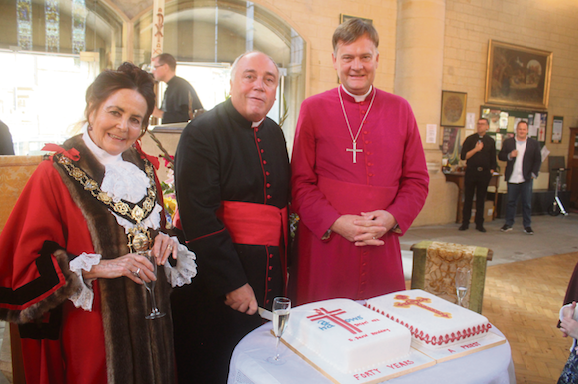 ‘I’m very lucky’: Priest celebrates 33 years at Gospel Oak church Father David cuts his cake with Father Jonathan Kester, Vicar of Emmanuel Church West Hampstead and Area Dean of North Camden, and Mayor Jenny Headlam-Wells