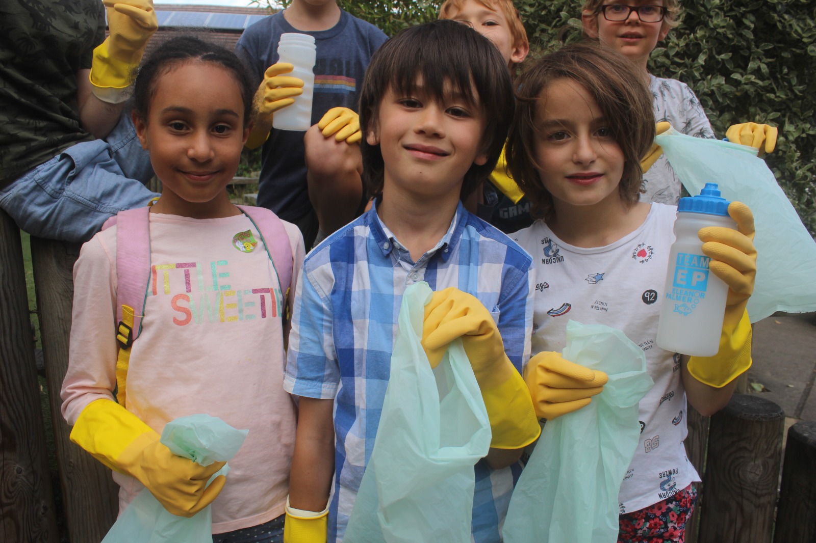 Lewis (centre) and his friends Aurélie and Neeva during their litter-picking birthday expedition around King’s Cross Station