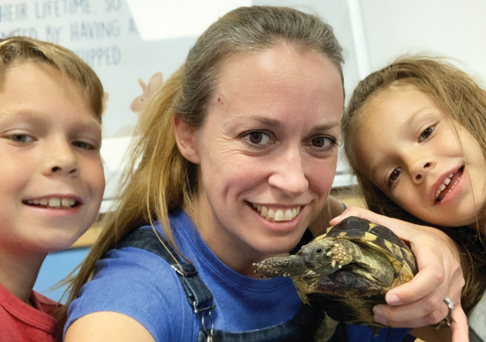 Shell and back: Tata the Tufnell Park tortoise is home at last Lucy Hepburn and her son Henry and daughter Mary with Tata