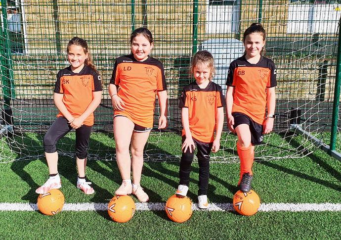 Coach’s goal is to get more girls on the ball Sienna Kimpson Laila Davies Kimberley Skendaj and Bella Benson