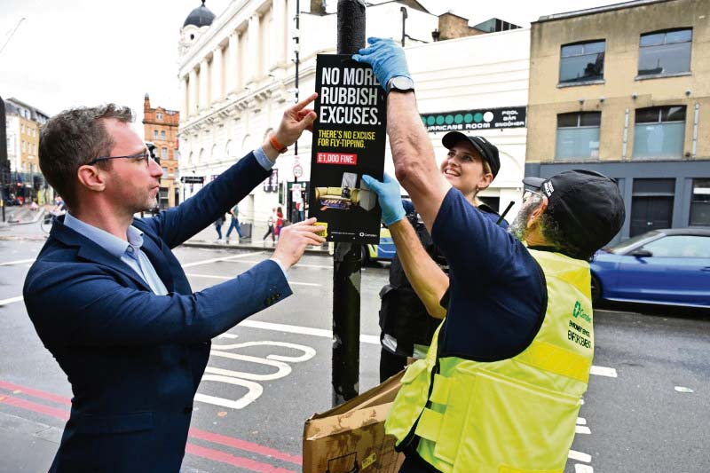 There’s more to this rubbish story, councillor Cllr Adam Harrison and fly-tipping sign